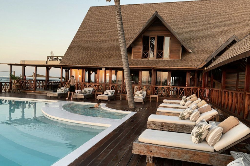 Sun loungers beside a resort pool